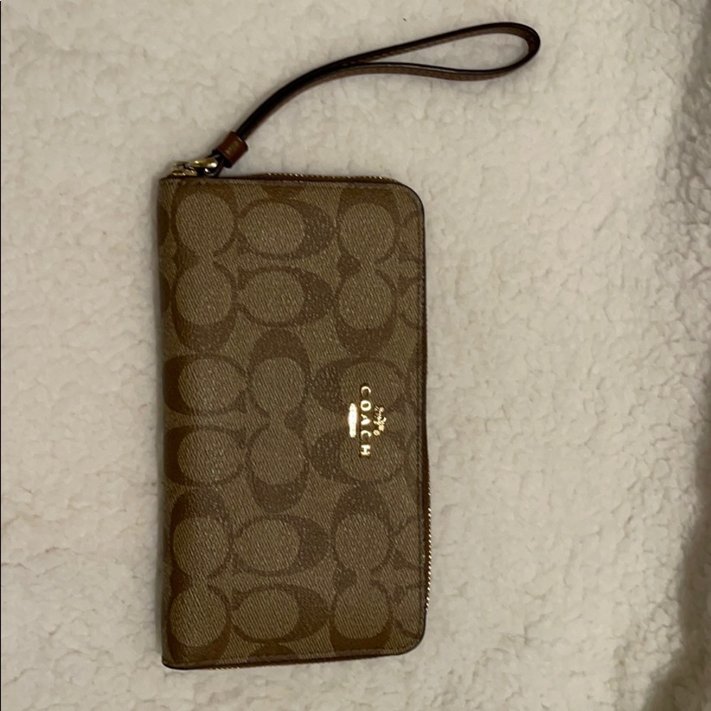 Brown and tan monogram Coach wristlet